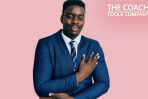 Businessman in blue suit giving himself some self-kindness with his hand on heart