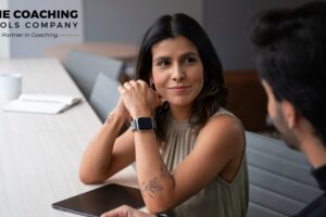 Smiling client with coach, showing trust and openness to change.